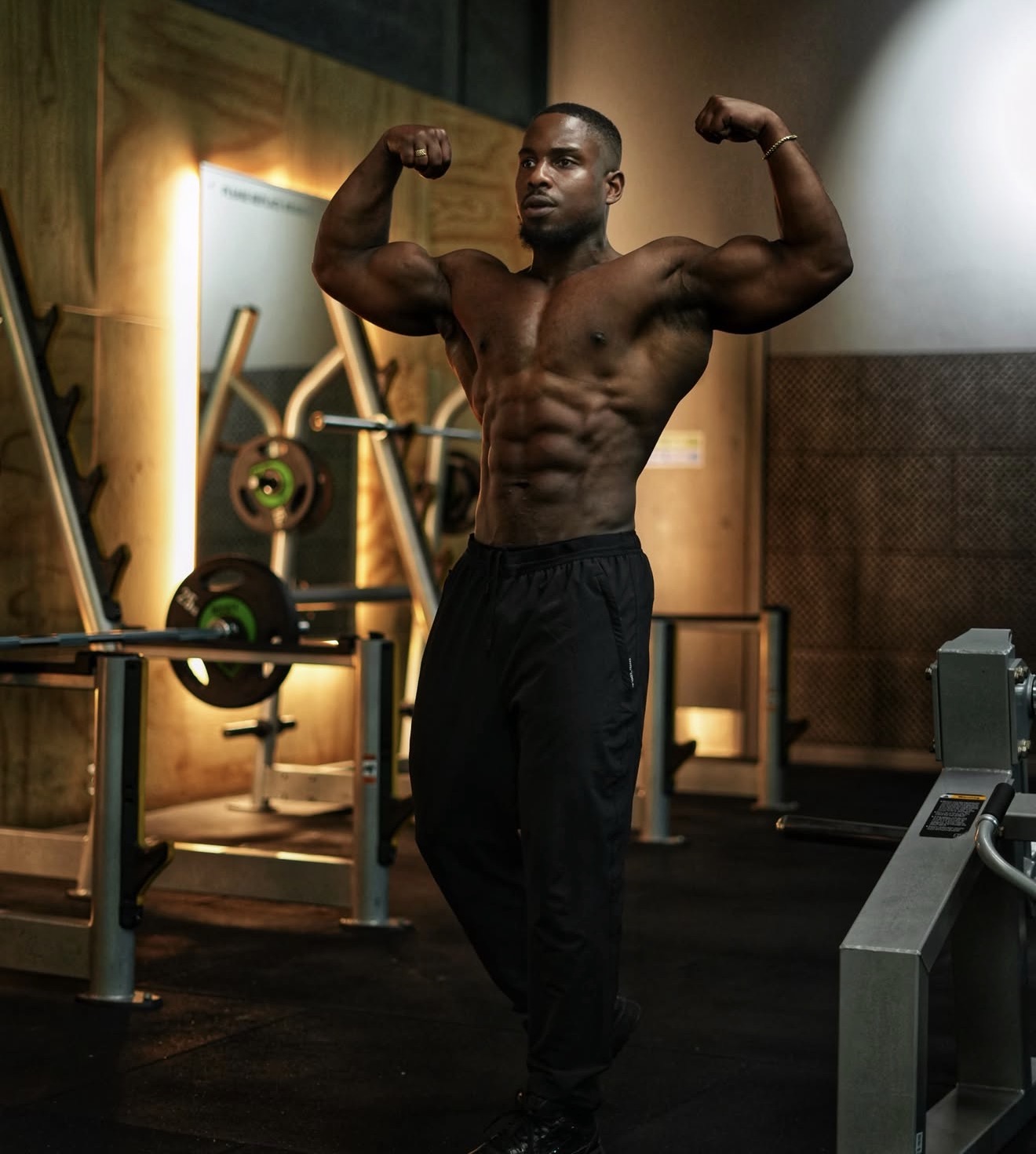 Marcel Nathaniel flexing in the gym